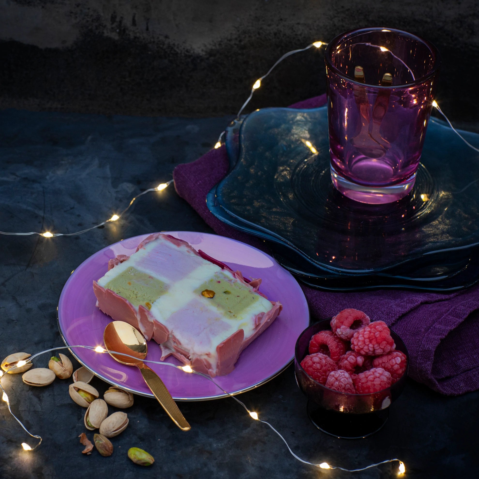 A slice of pistachio and raspberry ice cream cube