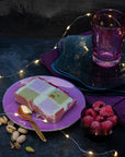 A slice of pistachio and raspberry ice cream cube