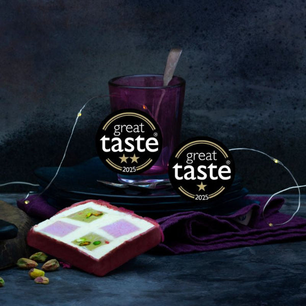 Dessert with 'Great Taste' awards on a dark background