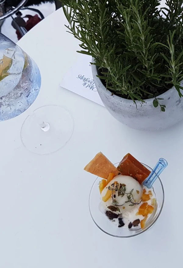 A scoop of Gin Mare & Tonic sorbet with bespoke toppings on the rooftop of the Hoxton Hotel