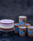 An ice cream cake and ice cream tubs selection