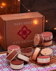 Ice cream sandwiches in different flavours on a tray, in front of a Ruby Violet box on a table with string lights in the background
