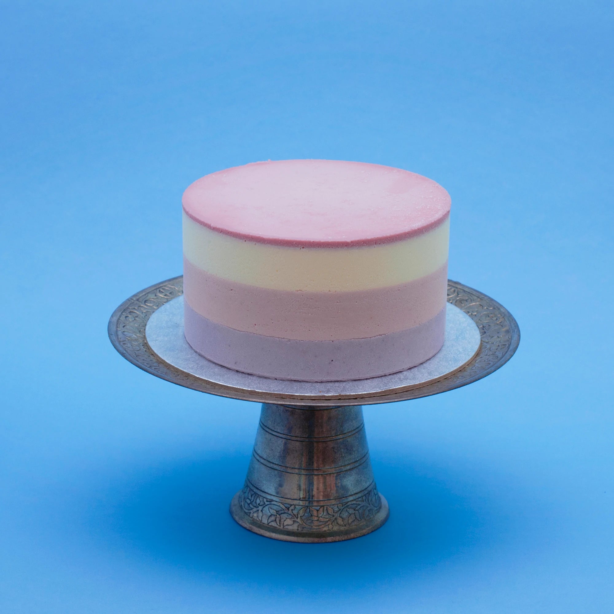 Miss Elodie ice cream cake,  a white, pink and purple cake with a pink ganache top and no decorations
