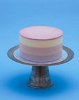 Miss Elodie ice cream cake, a white, pink and purple cake with a pink ganache top and no decorations