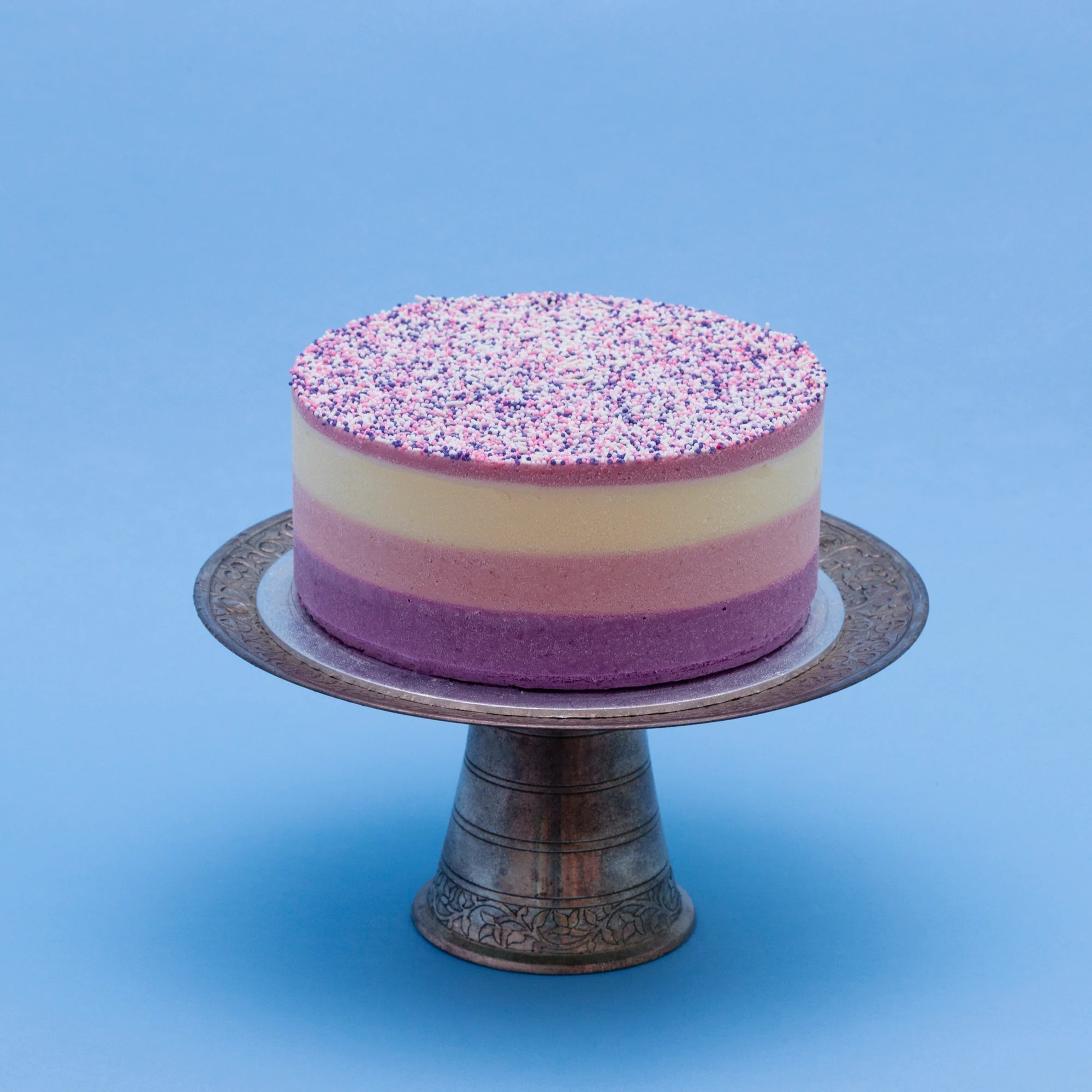 Miss Elodie ice cream cake, a white, pink and purple cake with a pink ganache top, decorated with sprinkles
