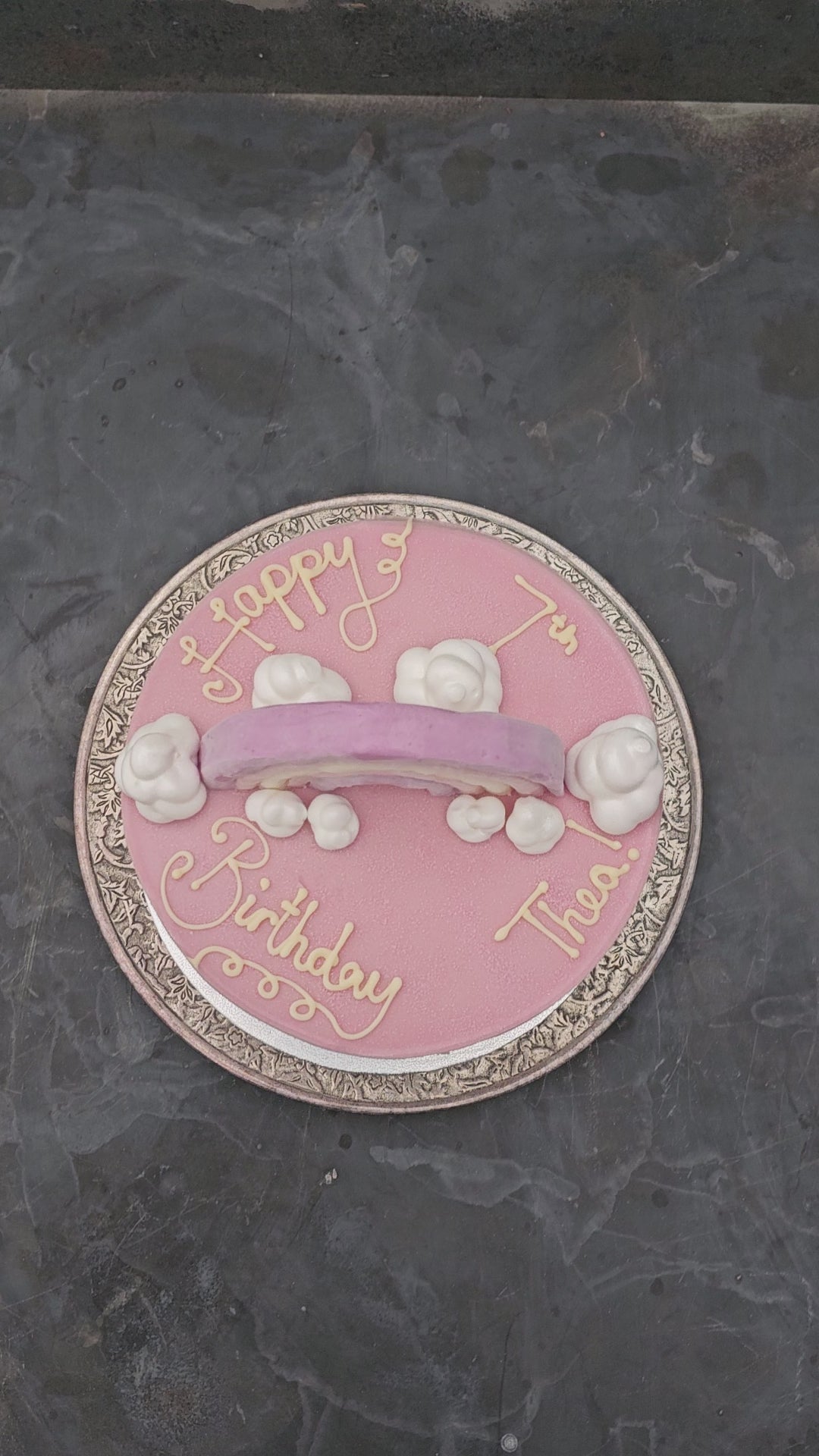 Video of a bespoke ice cream cake decorated with a rainbow