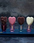 Small assorted heart-shaped ice creams on sticks