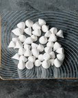 Mini meringues on a decorative glass plate