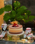 Uncle Horace ice cream cake surrounded by jars of toppings and sauces