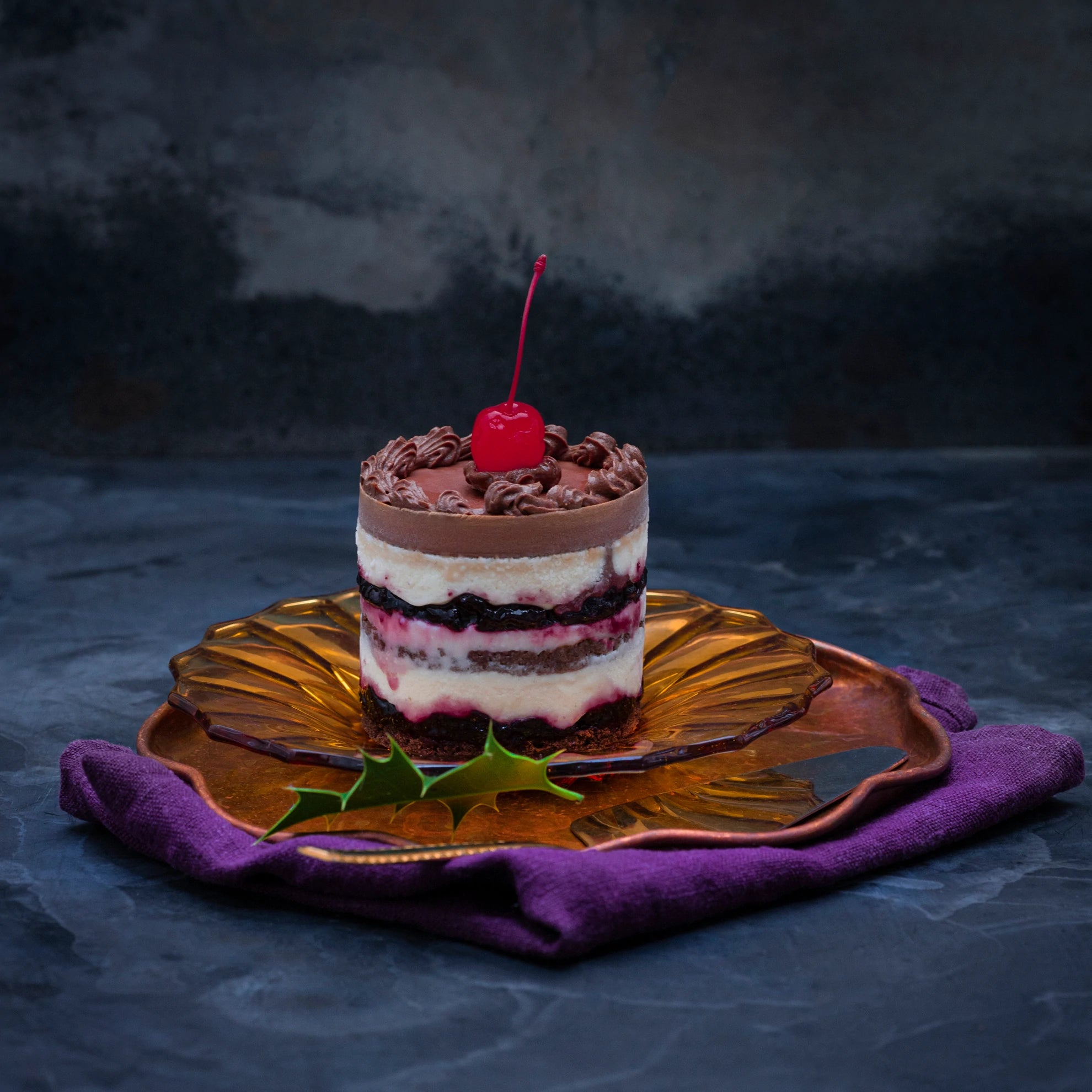 A Black Forest Gateau with a Maraschino cherry on top
