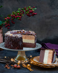 Hazelnut Chocolate ice cream cake on a stand, with a slice cut out