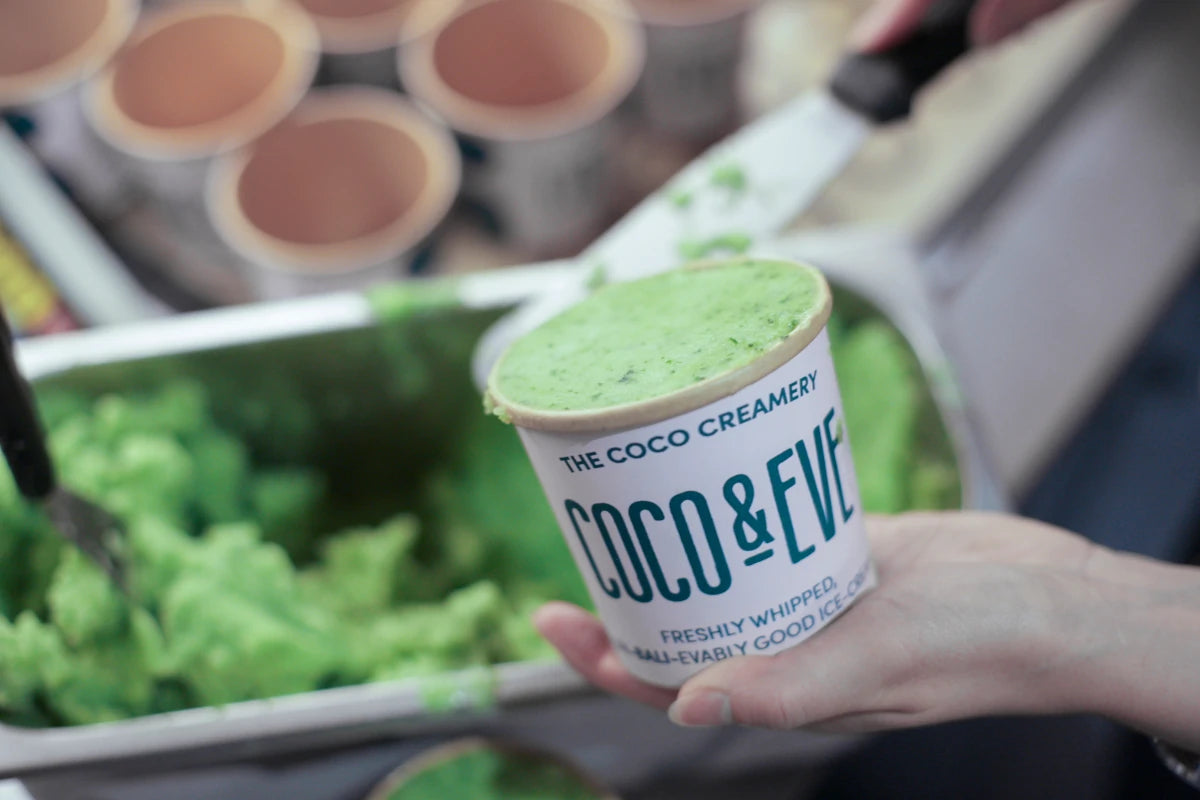 A tub of mint and cucumber sorbet being filled