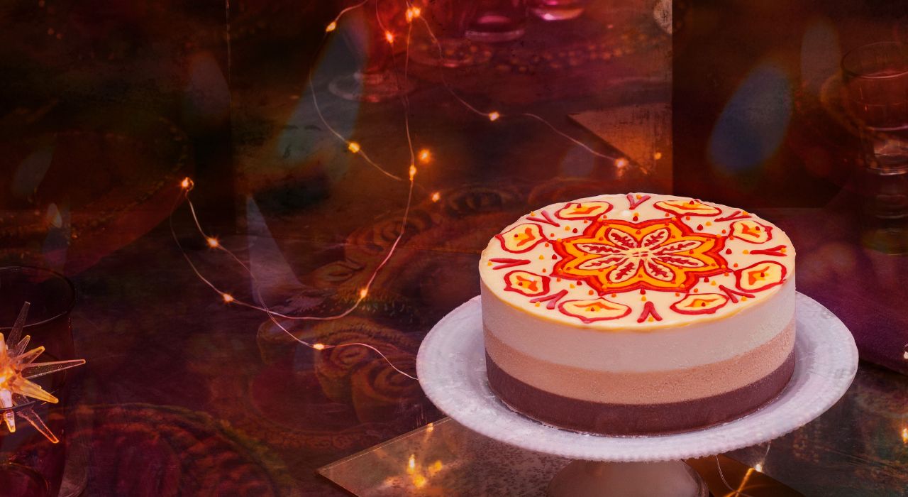 An ice cream cake hand decorated with an Indian design