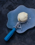 A scoop of organic milk ice cream on a plate