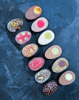 Easter Eggs filled with ice cream cut through the middle, with yolks and fillings in different colours