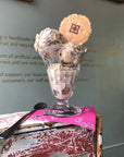 Scoops of stracciatella ice cream in a glass with a wafer