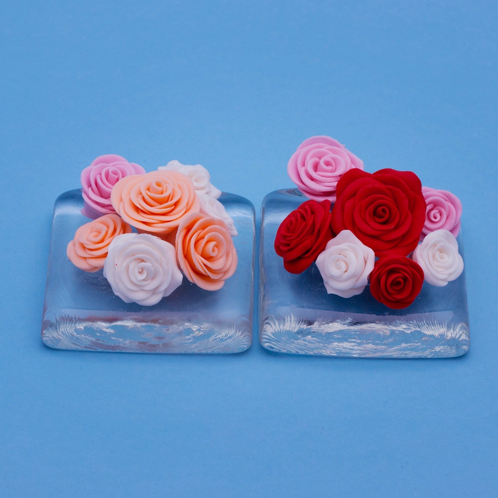 Fondant roses in mixed colours on two glass trays