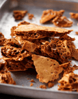 Close up of handmade honeycomb on a sheet of baking paper