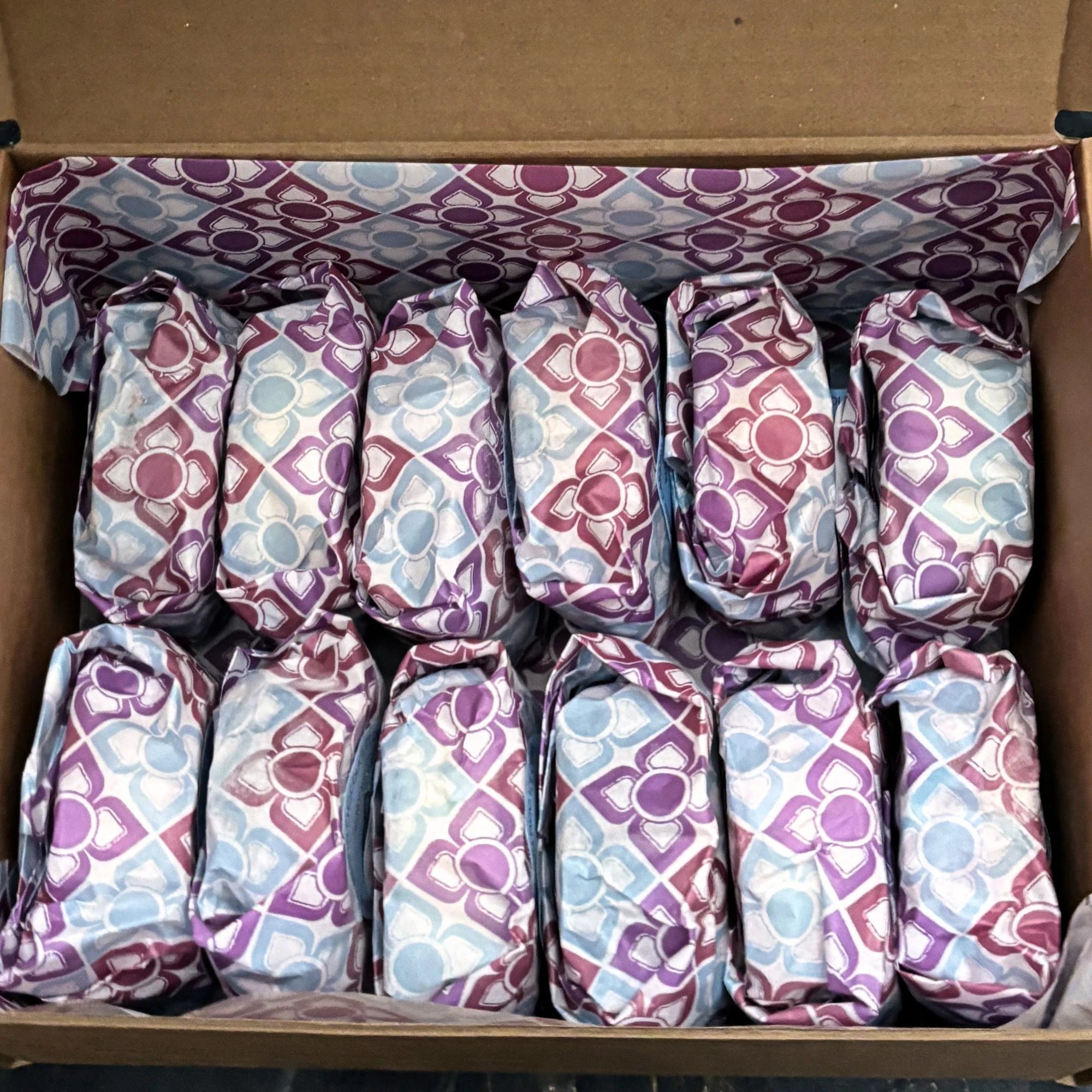 Ice cream sandwiches in their box, wrapped with colourful paper