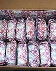 Ice cream sandwiches in their box, wrapped with colourful paper