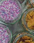 Jars of handmade toppings seen from above