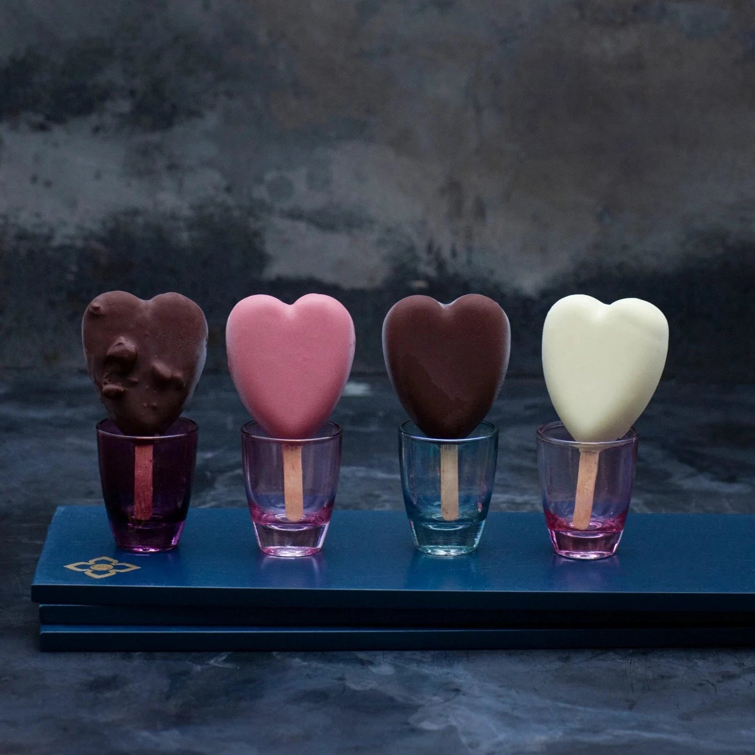 Small assorted heart-shaped ice creams on sticks