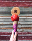 Strawberry sorbet scoop on a cone